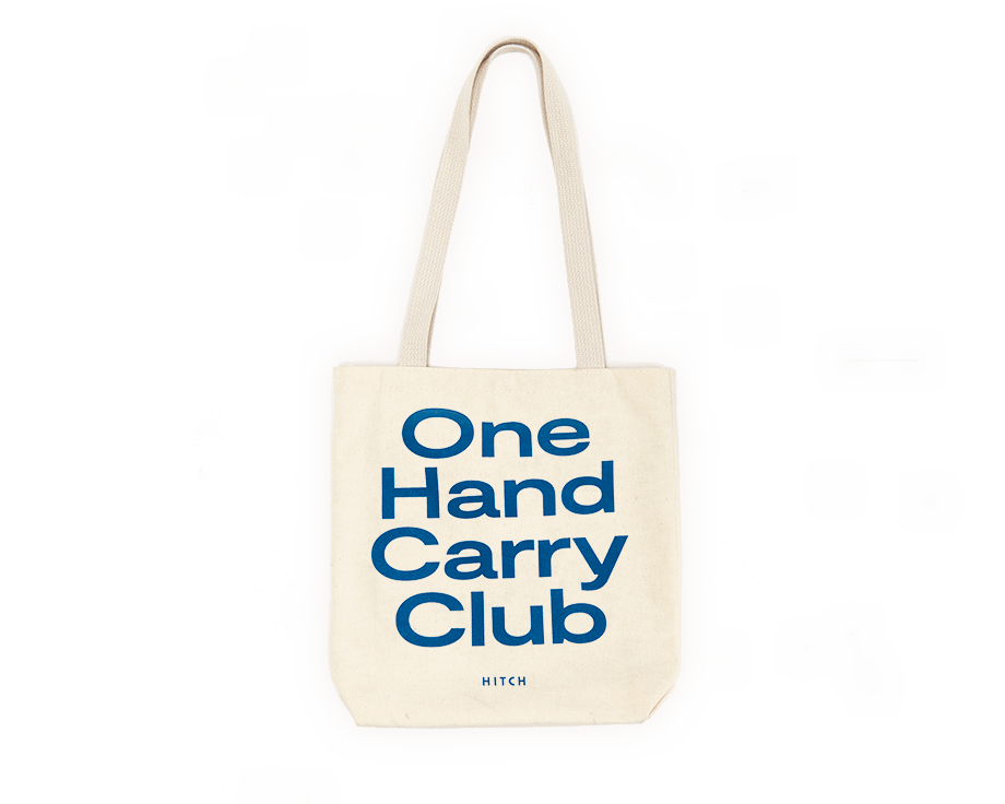 Canvas Tote with shoulder strap, text says One Hand Carry Club
